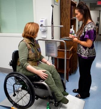 a wheelchair user on the accessible scale